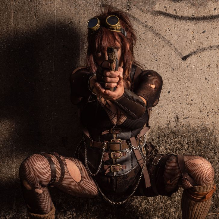 Steampunk-karakter med goggles og pistol